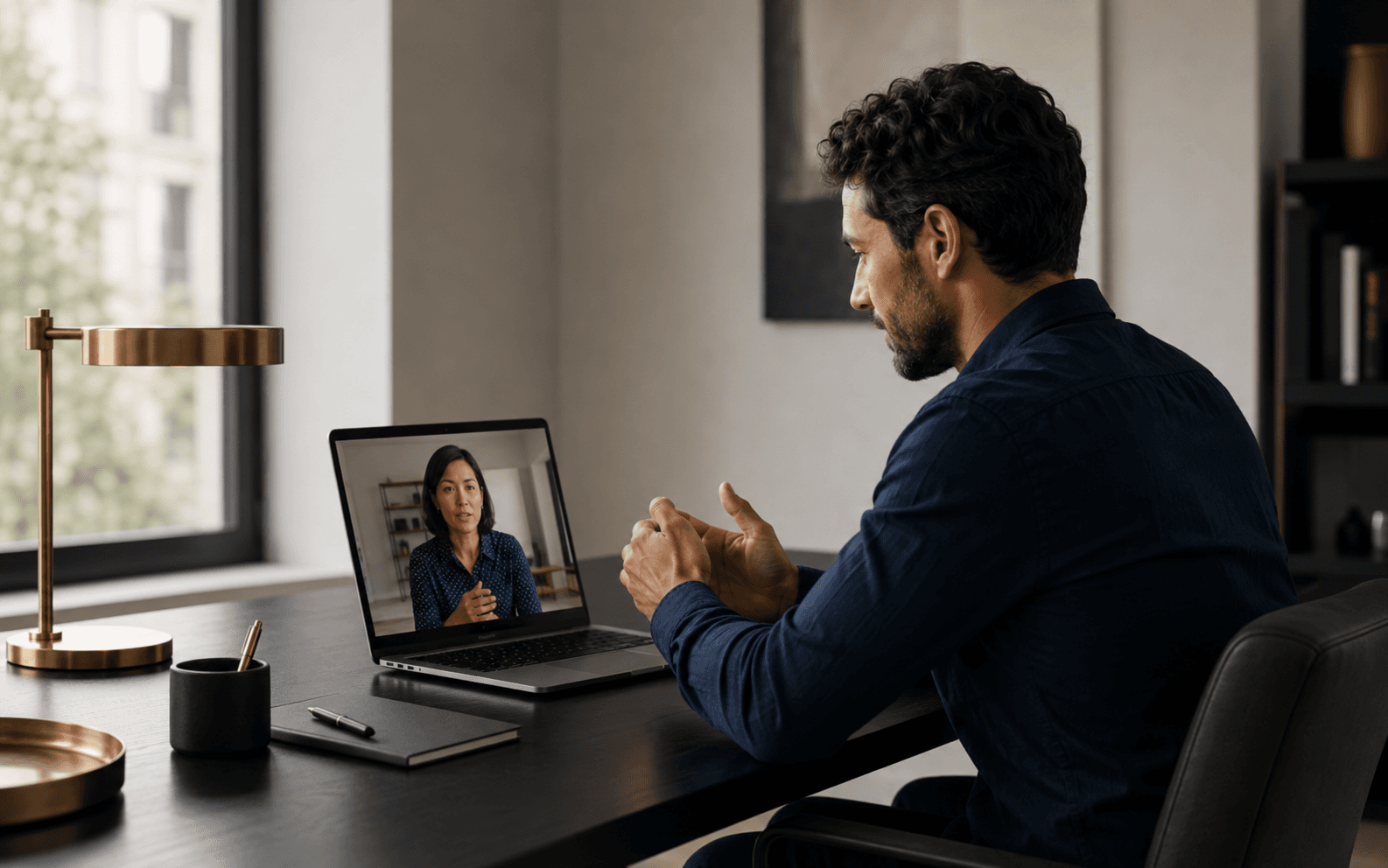 A professional on a video call with a remote colleague.
